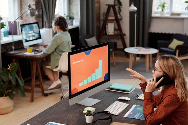 Property managers working on property marketing in a home office space